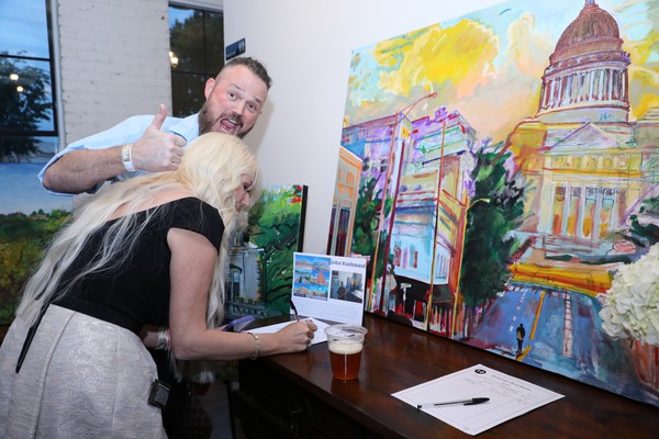 QQA Members bid on auction item